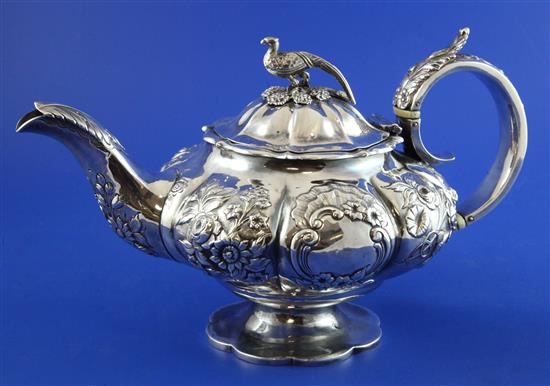 A William IV silver melon shaped teapot, gross 23 oz.